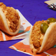 Product shot of the regular and spicy Crispy Chicken Sandwich Taco on a purple table